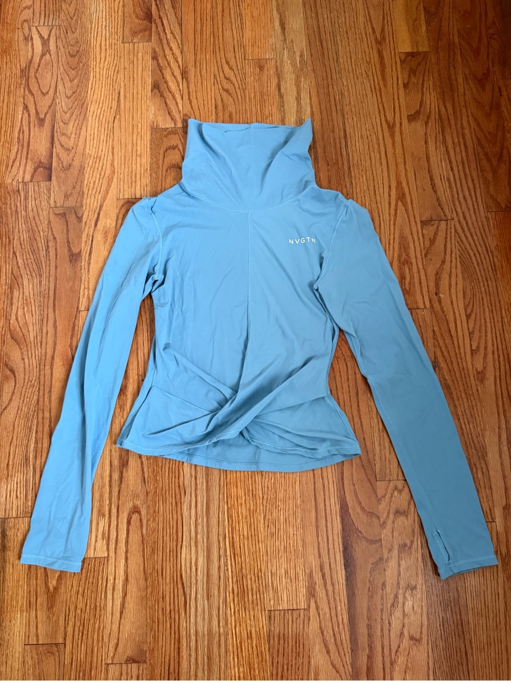NVGTN Focus Pullover blue athletic long-sleeve top front twist thumbholes